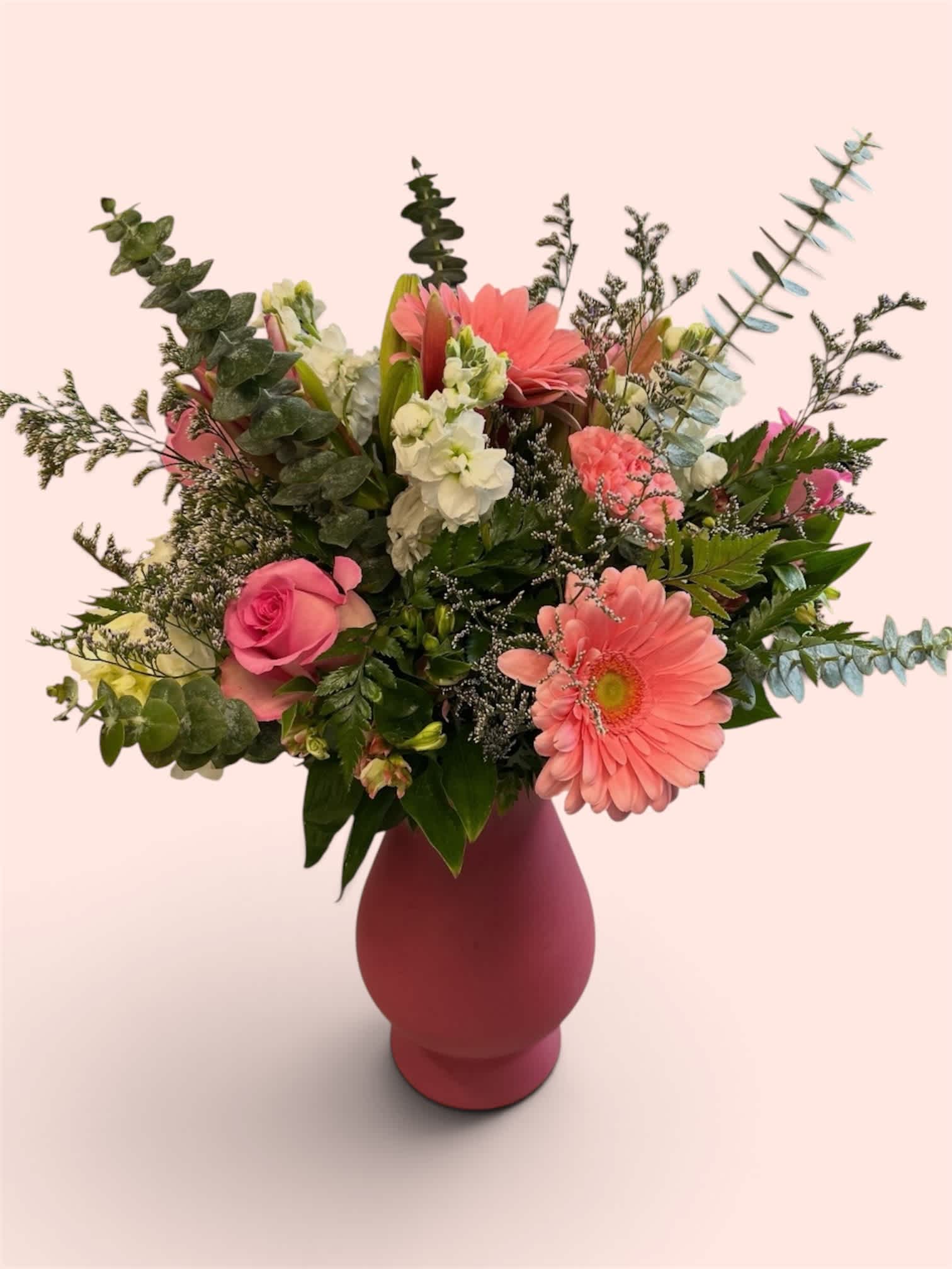 Pink and white mixed flower arrangement in a vase