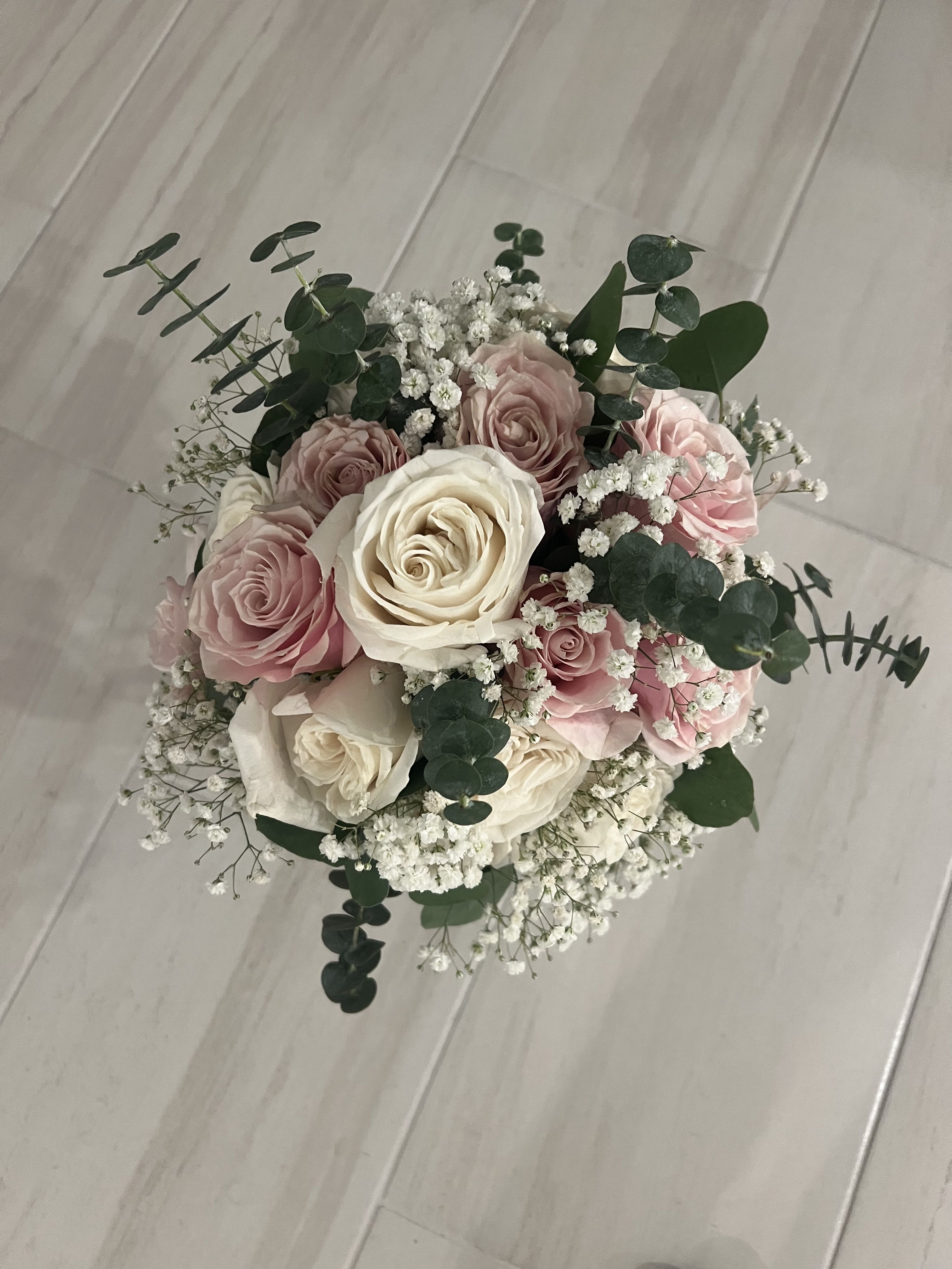 Bouquet - romantic and delicate bouquet, composed of soft white roses and baby pink roses, enhanced by the ethereal lightness of baby’s breath (gypsophila). Fresh eucalyptus adds a wild yet elegant touch, creating a perfect balance between sweetness and natural freshness. Ideal for brides seeking a classic, tender, and sophisticated style.