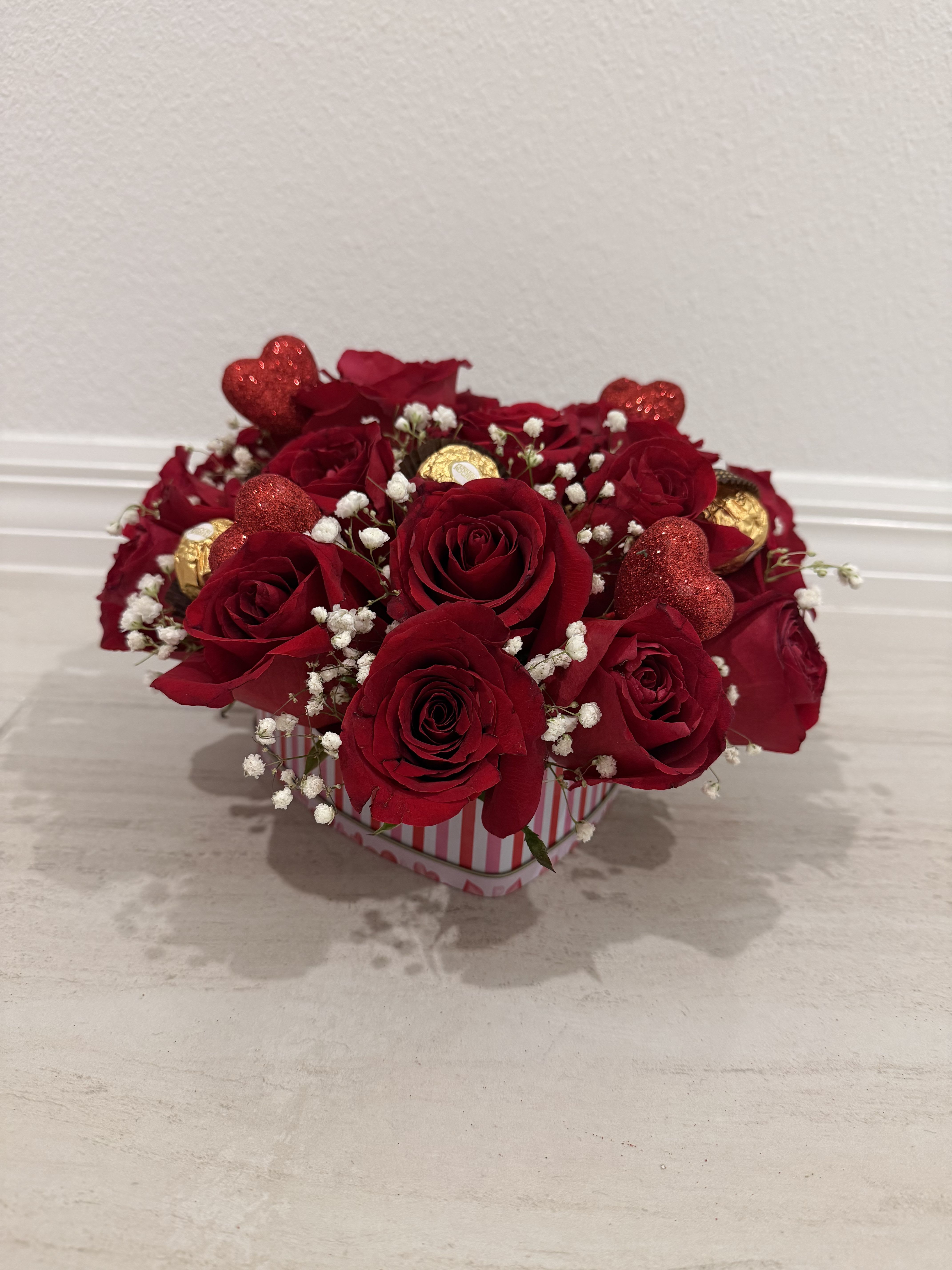 Sweetheart Rose &amp; Chocolate Box - A classic and romantic arrangement featuring fresh red roses accented with delicate baby’s breath and premium Ferrero Rocher chocolates. Designed in a charming heart-themed container with elegant details, this arrangement is perfect for Valentine’s Day, anniversaries, or any occasion that calls for love and sweetness.