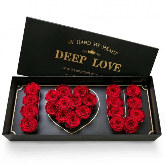 Red roses arranged in a black gift box spelling "I LOVE U"