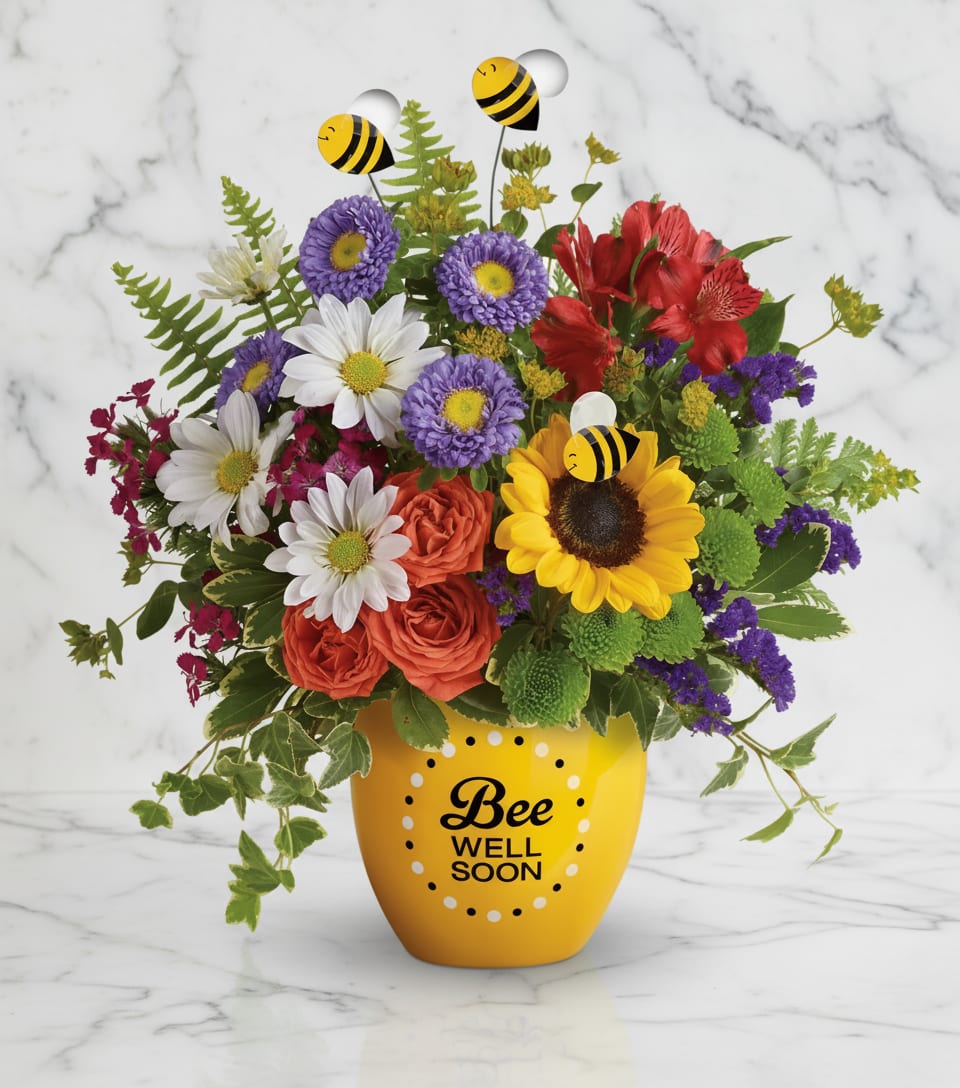 Garden Of Wellness Bouquet - Boost their spirits and brighten their day with this garden of wellness! Hand-delivered in a sweet ceramic "Bee Well Soon" pot, this colorful arrangement of roses, alstroemeria and asters is abuzz with delightful bee decorations - and your very best wishes for a speedy recovery.