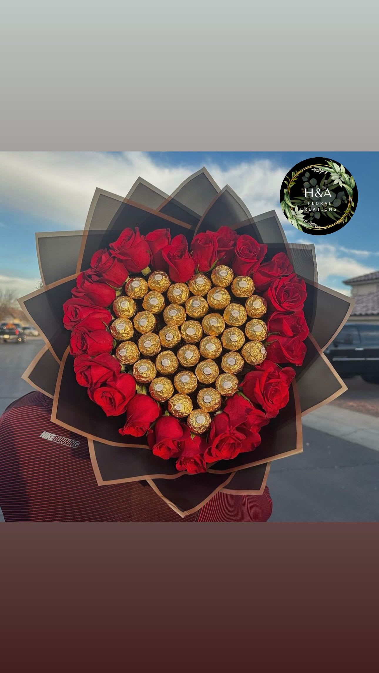 Heart-shaped bouquet of red roses and gold-wrapped chocolates
