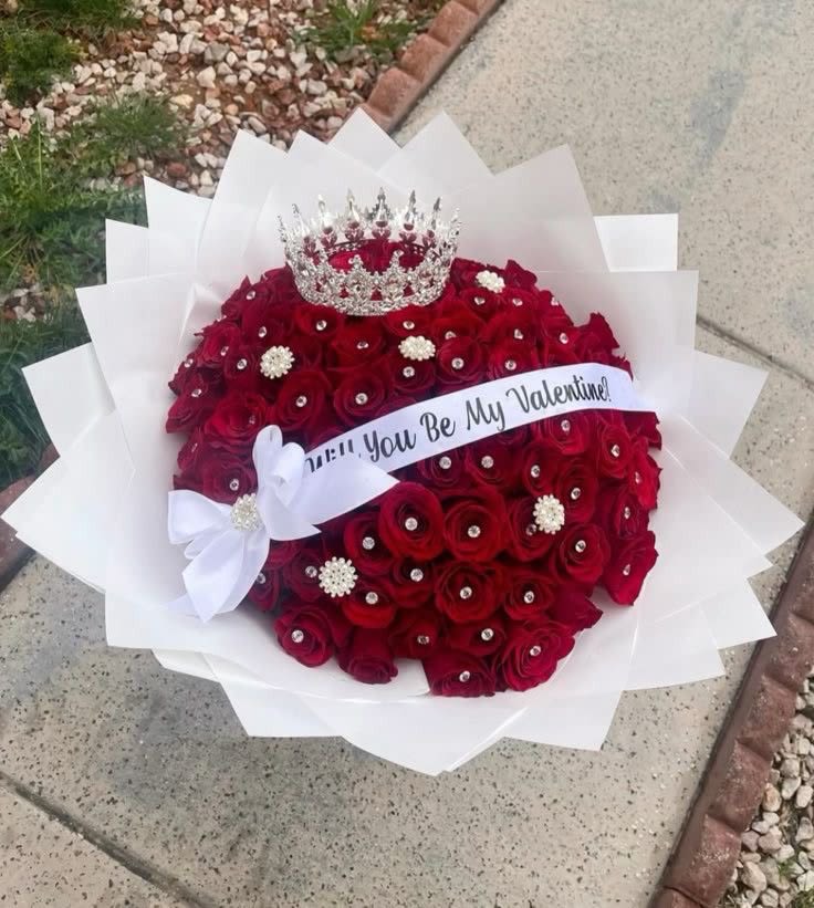 Red rose bouquet with a crown and Valentine ribbon