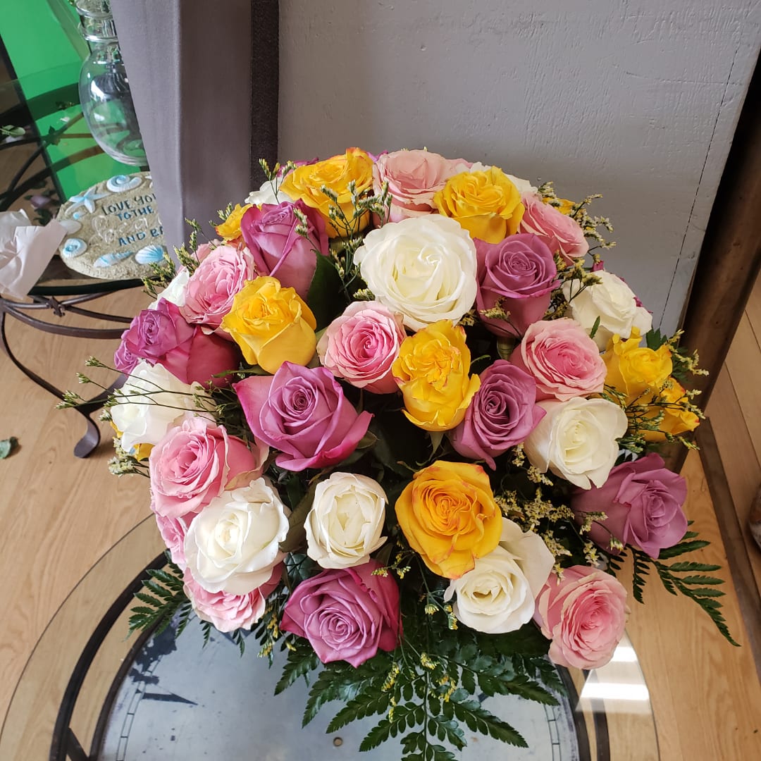Bouquet of multicolored roses in pink, yellow, and white