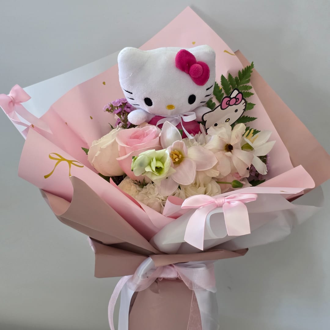 Pink bouquet with a Hello Kitty plush and pastel flowers wrapped in pink paper