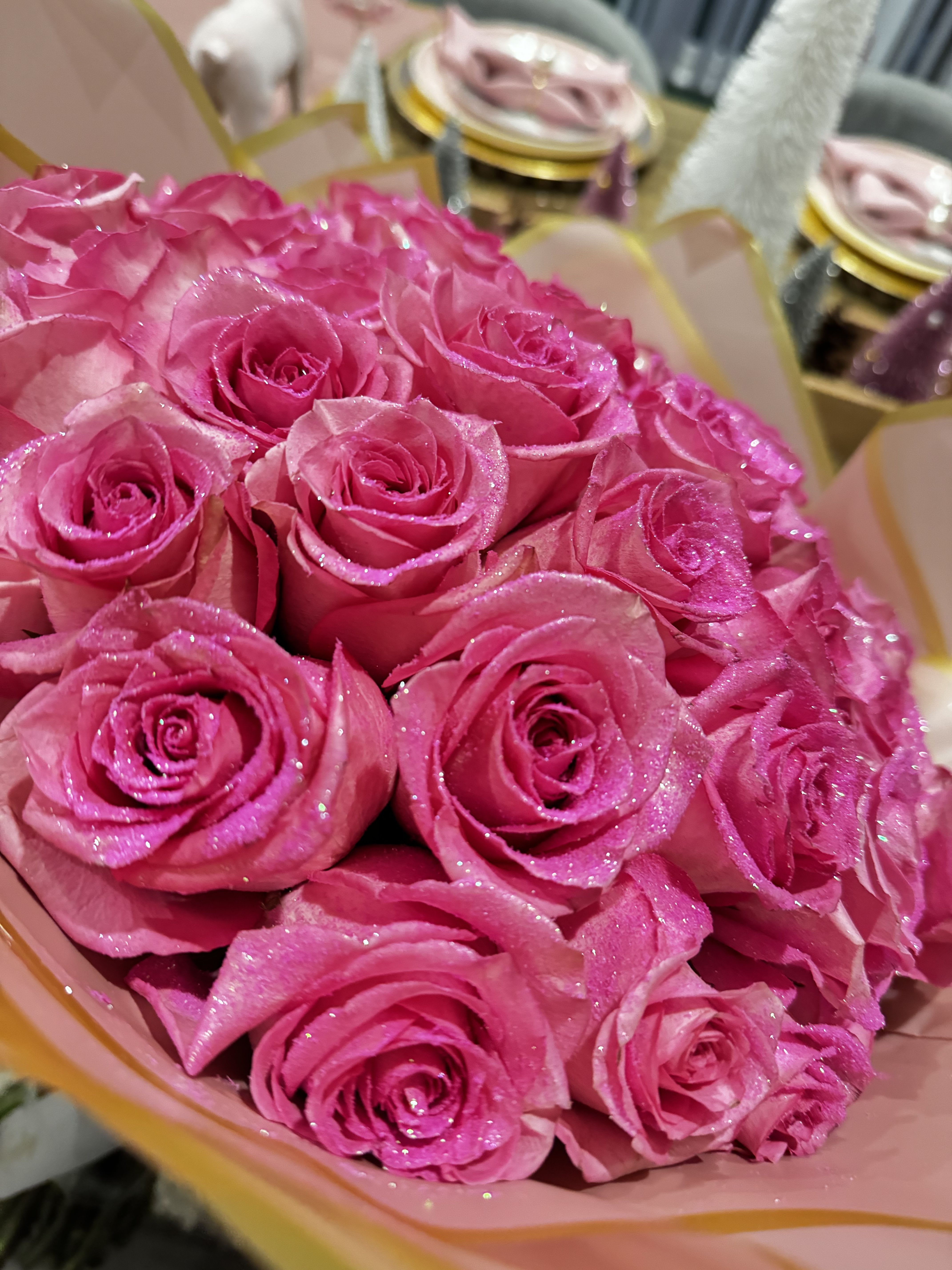 Bouquet of bright pink roses with glittery petals