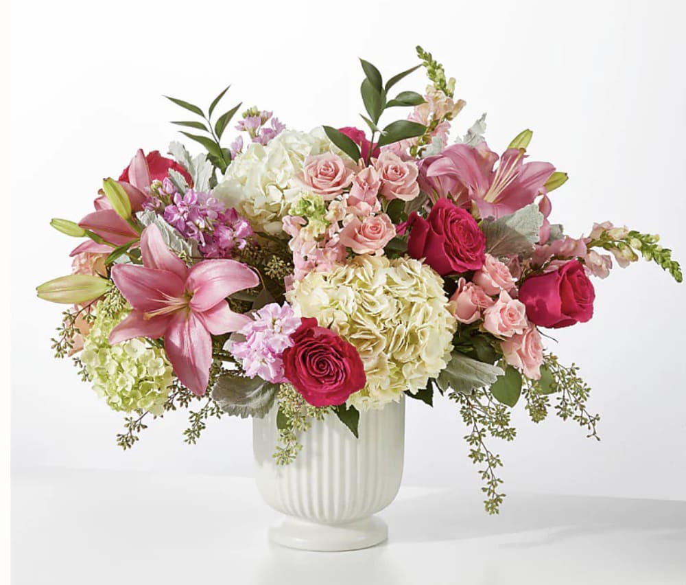 Antique Shopping Bouquet - A spectacularly striking arrangement of hot pink, pale pink, white and green blooms is artfully arranged by a local florist to convey your heartfelt message.