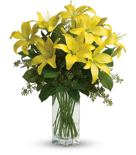 Teleflora's Lily Sunshine - When it comes to spring flowers, the lily reigns supreme. It's easy to see why in this gorgeous bouquet of bright yellow blooms. 