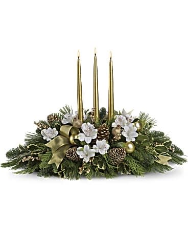Royal Christmas Centerpiece - Fit for royalty! Dress up your Christmas dinner with this elegant white and gold centerpiece - or send it as a festive holiday gift to someone you especially treasure. Delicate white alstroemeria sit softly amongst Christmas greens including variegated holly, flat cedar, noble fir and white pine. Golden pinecones, mesh ribbon, ornaments and berries echo the golden glow of three glamorous taper candles. Orientation: All-Around