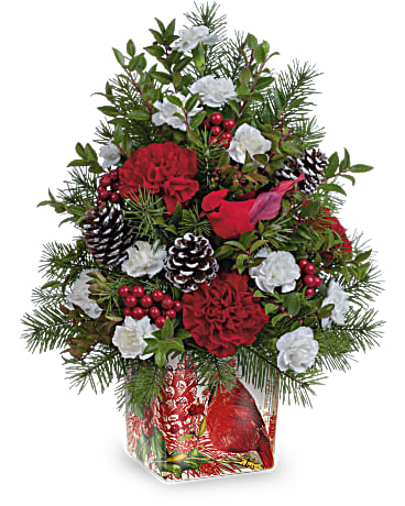 Teleflora's Cardinal In Flight Tree - Wondrous winter whimsy for any Christmas celebration! This charming floral "tree" is presented in a winter cardinal cube vase that lives on as a vintage-inspired votive holder. This festive holiday arrangement features red carnations, miniature white carnations, red huckleberry and douglas fir. Teleflora's Cardinal In Flight Bouquet is delivered in Teleflora's Cardinal Cheer Cube. Orientation: All-Around