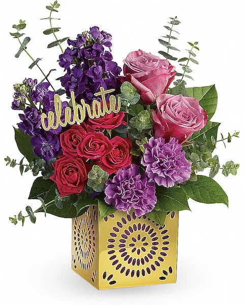 Bouquet of pink and purple flowers in a yellow decorative box