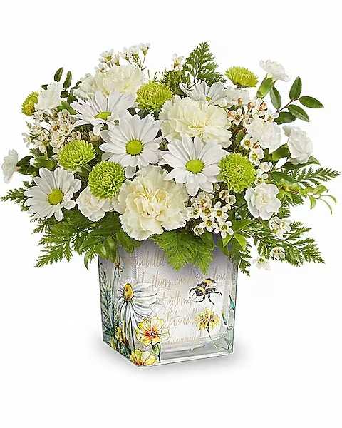White daisies and carnations in a decorative square vase