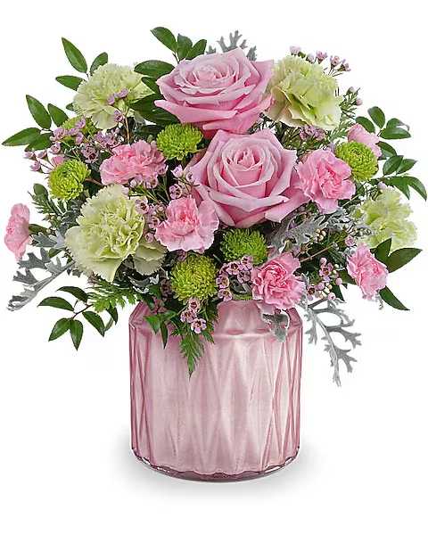 Pink roses and carnations in a pink glass vase
