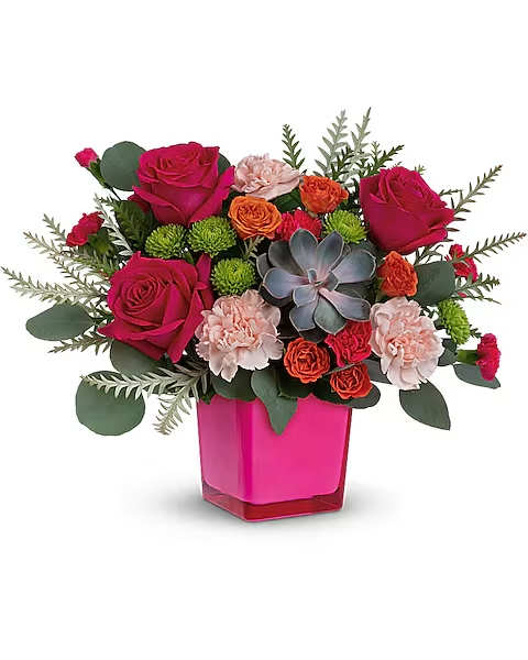 Pink and orange flower arrangement in a magenta vase