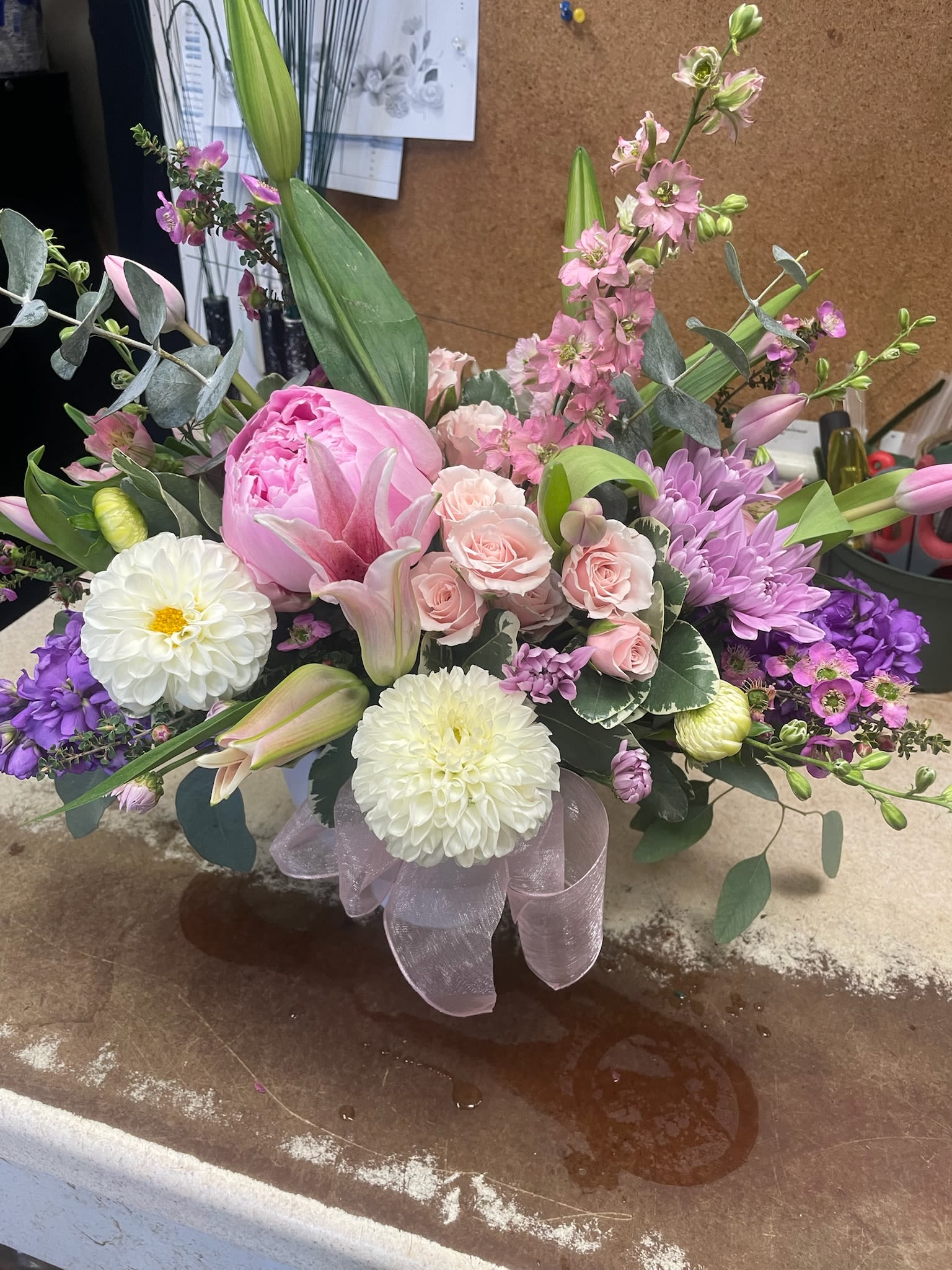 Pink and purple mixed flower arrangement with lilies and dahlias