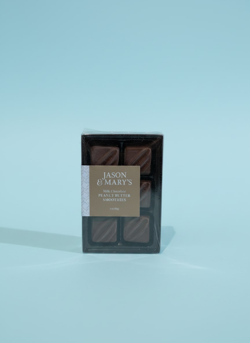Box of milk chocolate peanut butter candies on a blue background