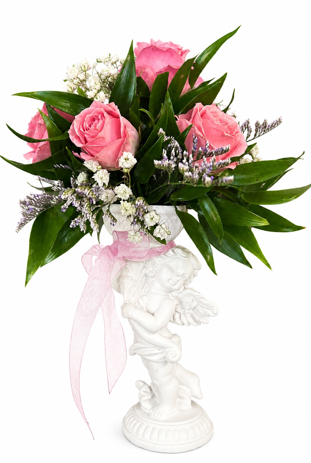 Pink roses and white filler flowers in a white cherub vase with a pink ribbon