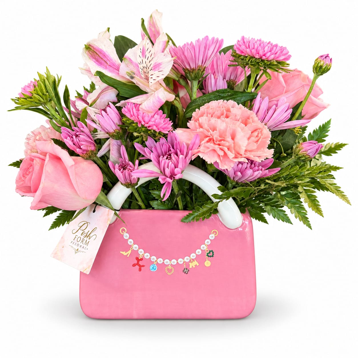 Pink mixed bouquet in a pink handbag-shaped container