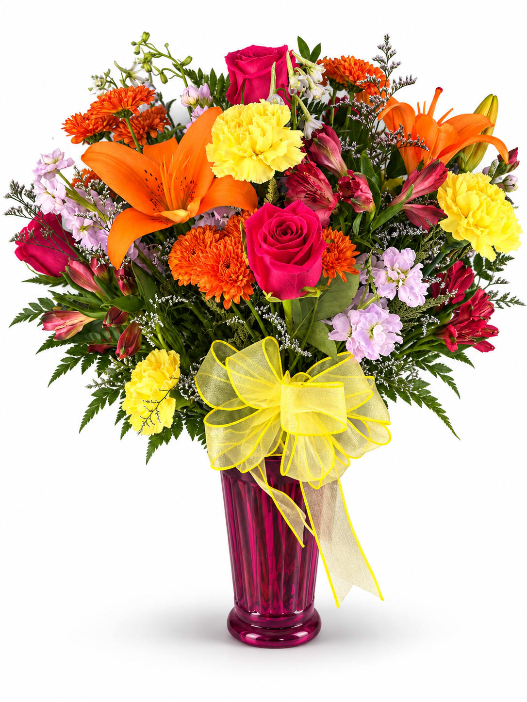 Bright mixed bouquet in a pink vase with a yellow bow