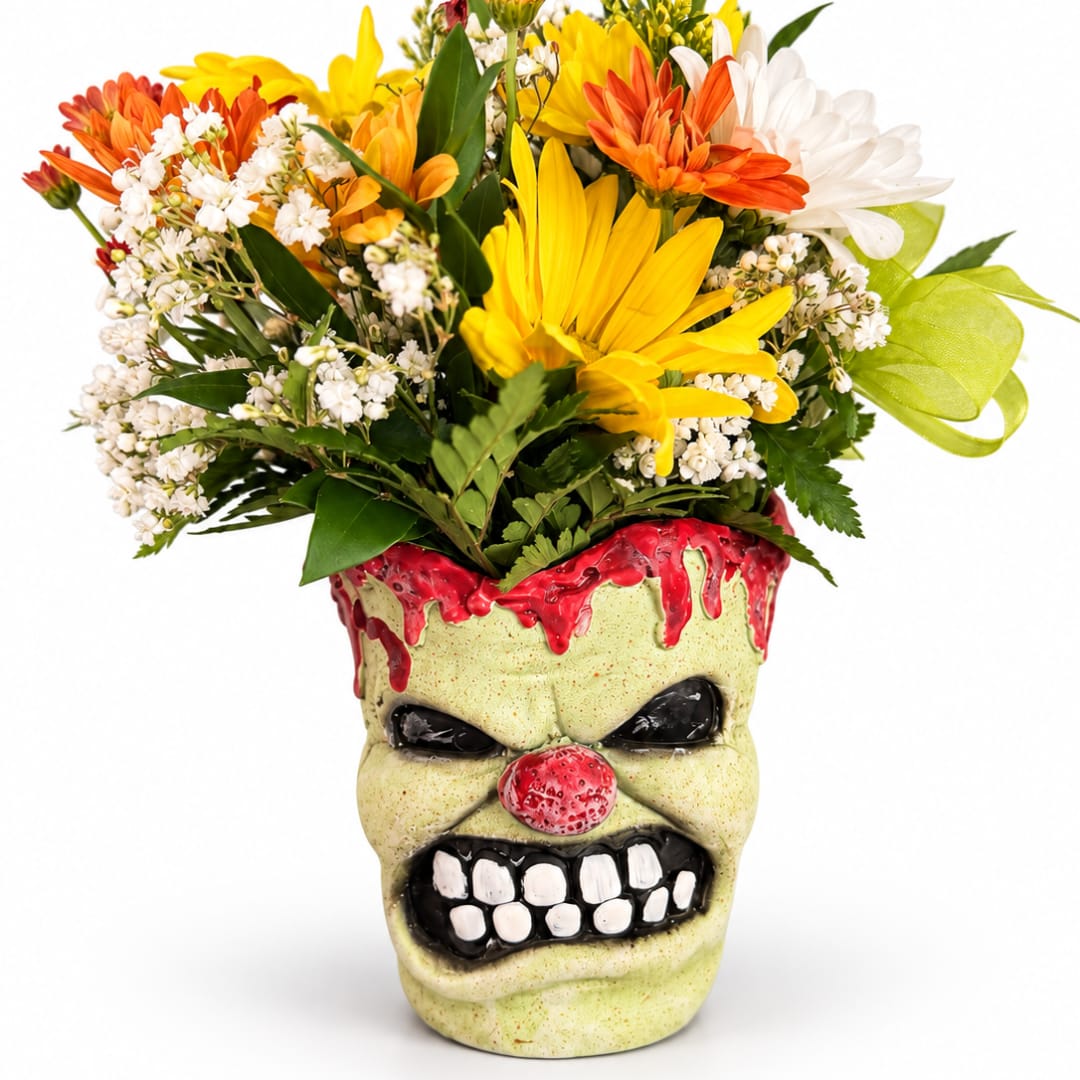 Colorful bouquet in a skull-shaped vase with a painted face