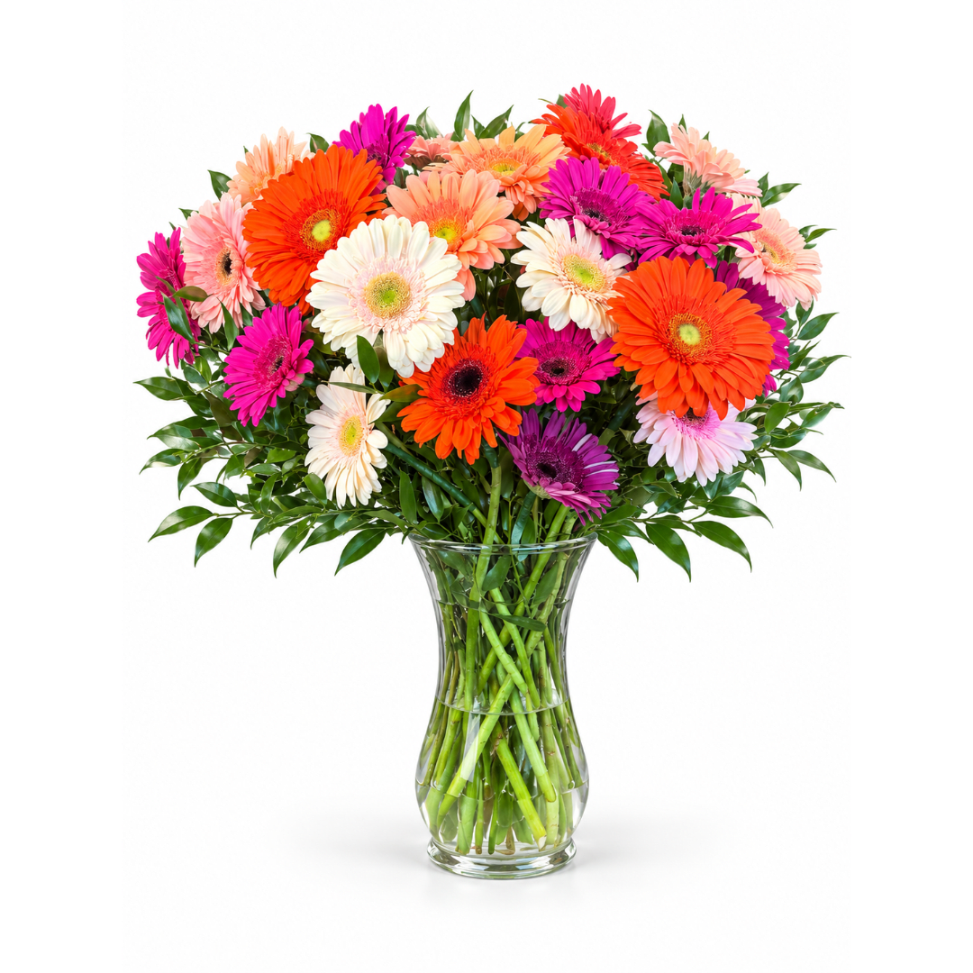 Colorful gerbera daisy bouquet in a clear glass vase