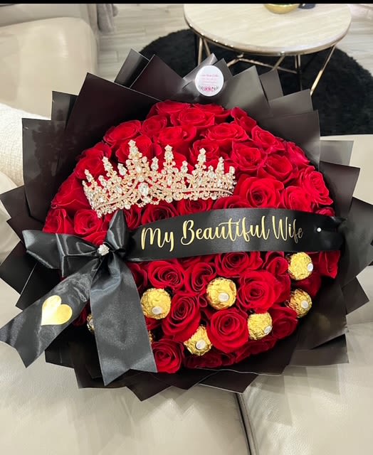 Bouquet of red roses with a tiara and black ribbon