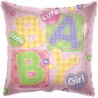 Pink pillow with colorful letters spelling BABY