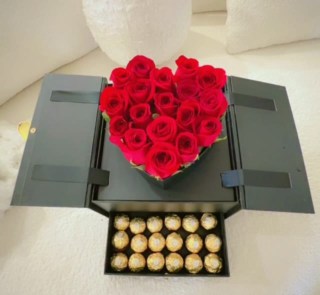 Heart-shaped red rose box with a tray of Ferrero Rocher chocolates
