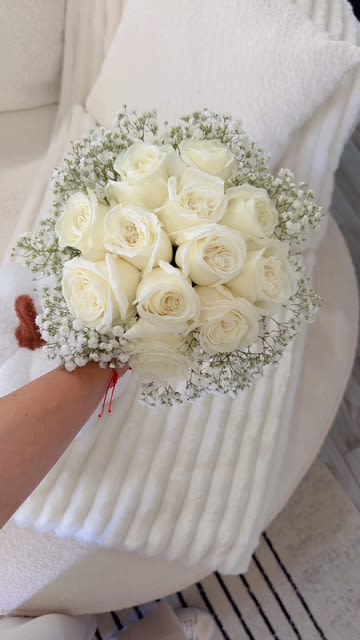 Bouquet of white roses with baby's breath