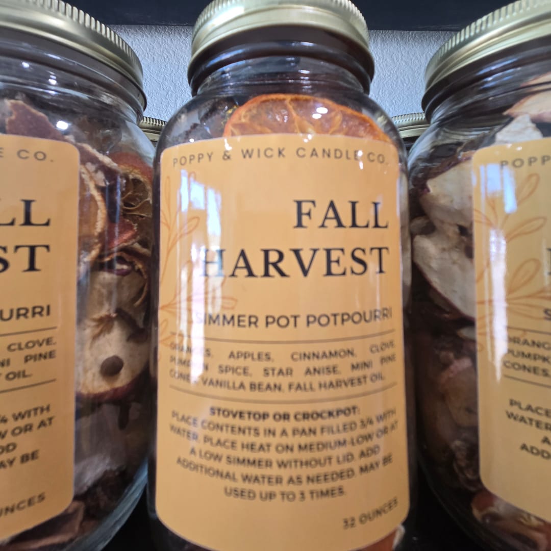 Jars of fall harvest potpourri with dried citrus slices and spices