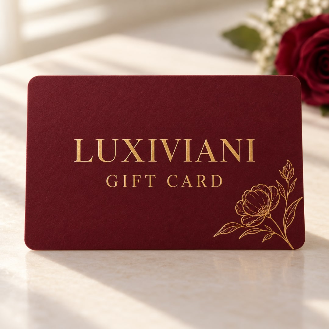 Burgundy gift card with gold floral lettering and line art