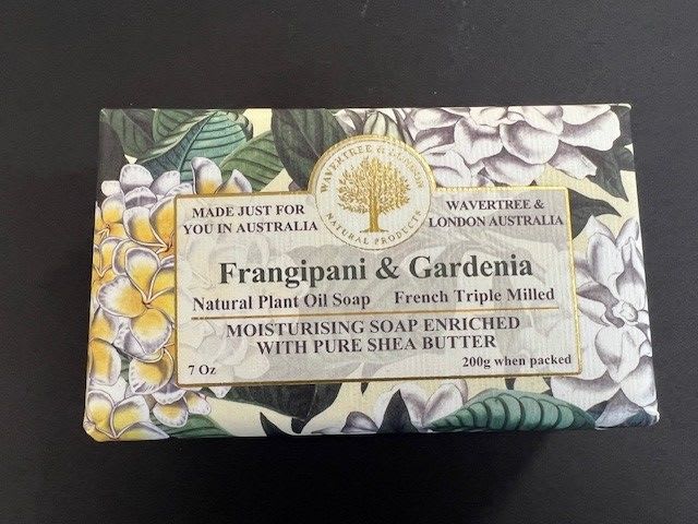 Wrapped bar of Frangipani and Gardenia soap with floral packaging