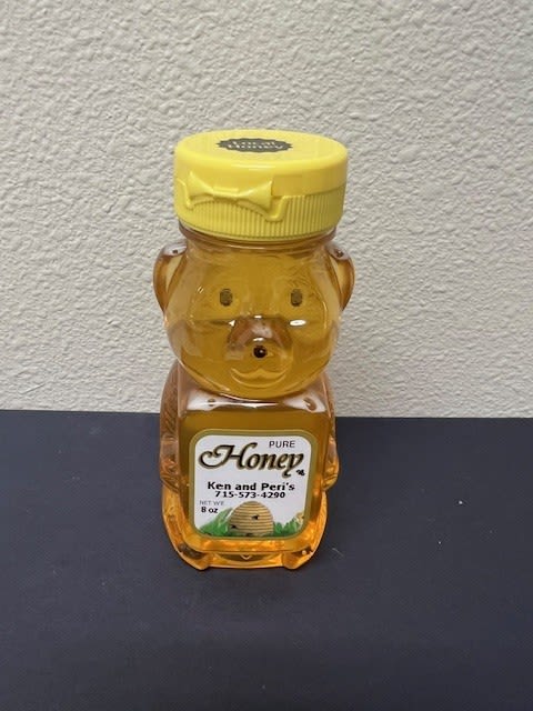 Bear-shaped honey bottle with a yellow cap