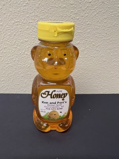Bear-shaped honey bottle with a yellow cap
