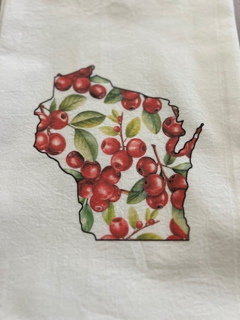 Wisconsin-shaped design filled with red berries and green leaves