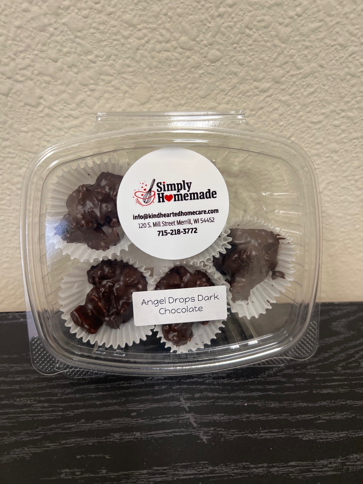Plastic clamshell container of dark chocolate clusters
