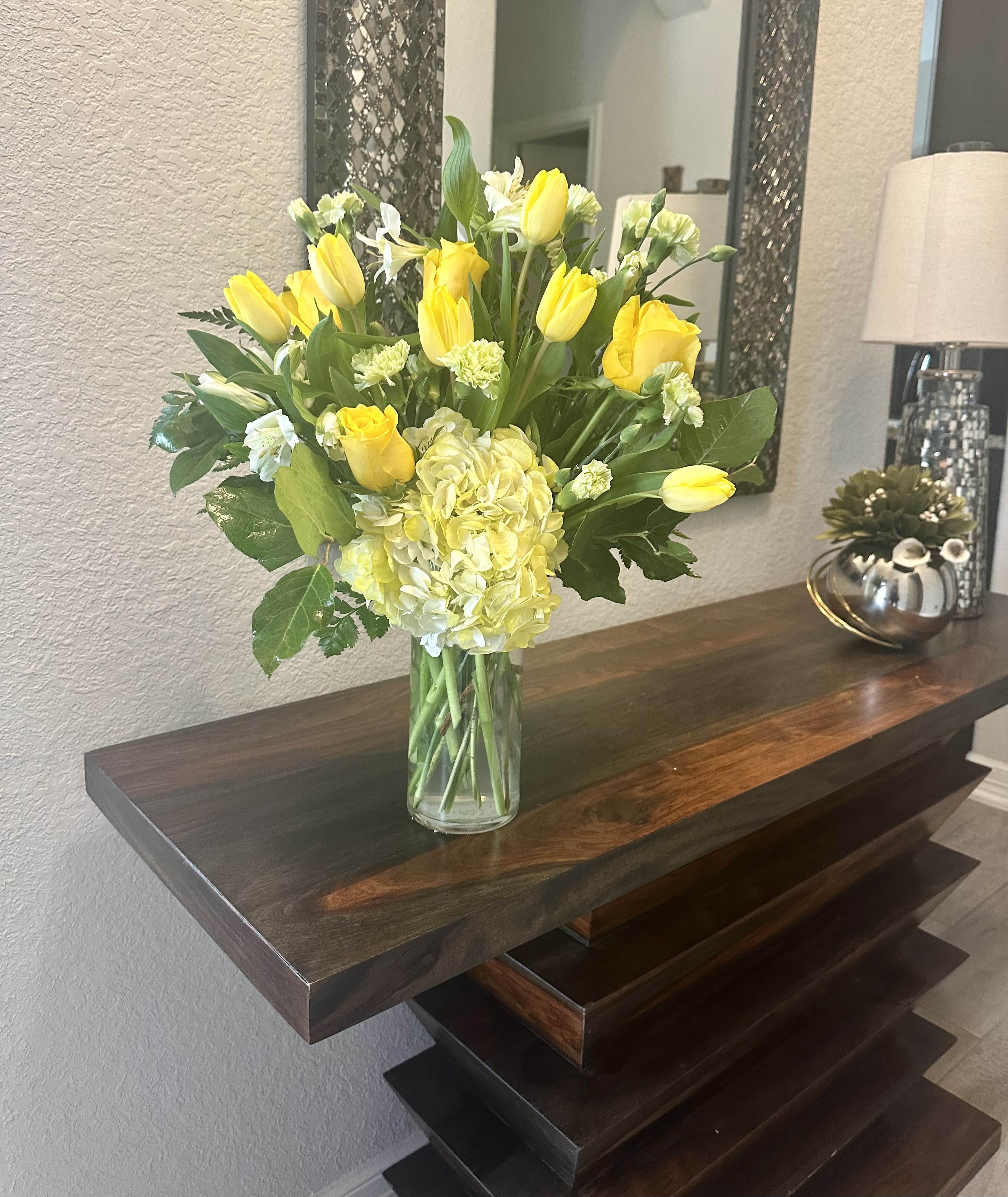 Charming yellow - A mixture of yellow tulips, roses, alstromeria, pixies and hydreangeas