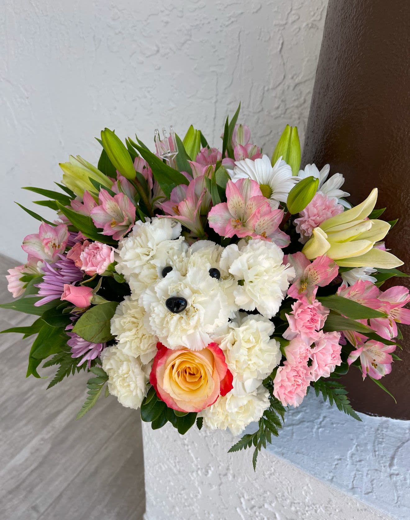 Beautiful puppy - Lovely pastel-colored arrangement of carnations, alstroemerias, lilies, and daisies.