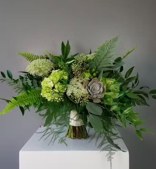 Green bouquet with hydrangeas and a succulent accent