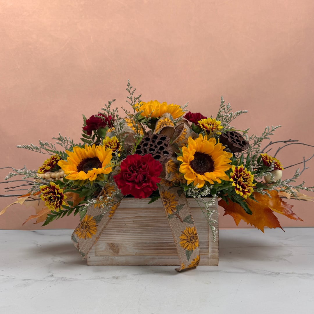 Sunflower and carnation arrangement in a wooden box with ribbon