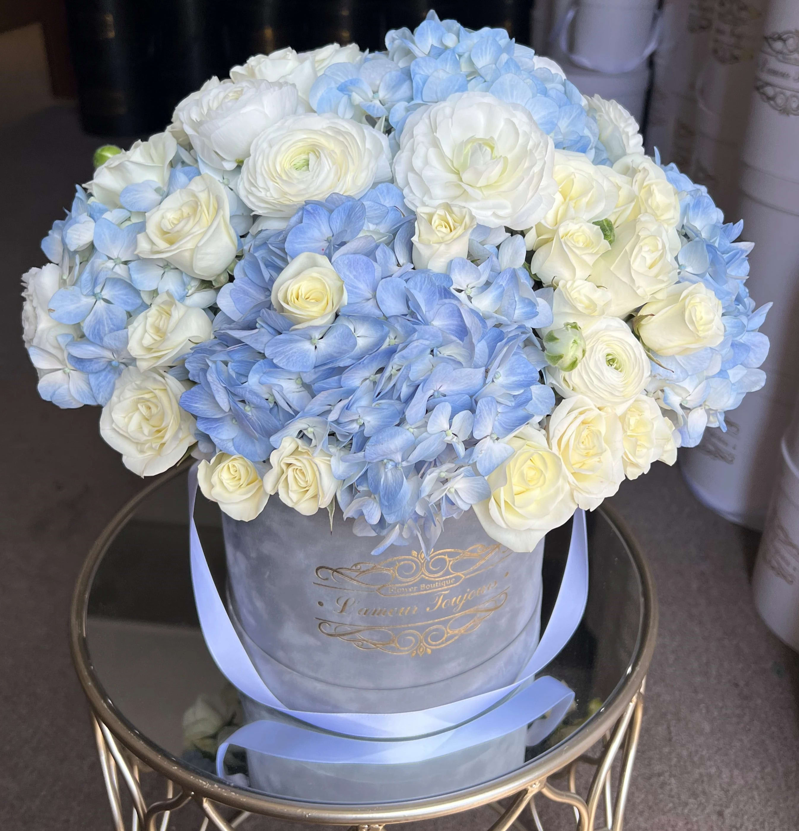 Baby Boy Signature Box - Luxurious mix of seasonal blue and white flowers in our Signature Grey Velvet Box