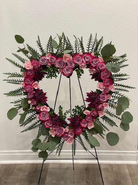 Celebration of Life - A beautiful purple and lavender heart.  Celebration of life piece 18inches  If a particular flower, is unavailable, an item of similar quality and value will be substituted.