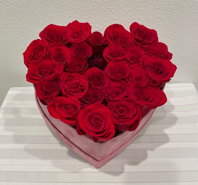 Lovers Heart - Pink heart box filled with two dozen red roses