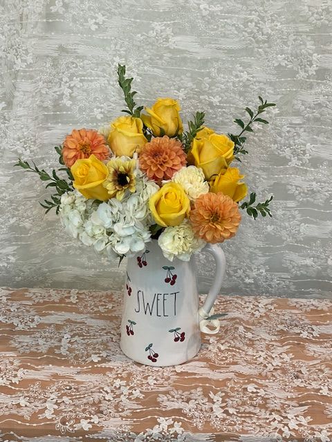 Sweet Lemonade - Pitcher filled with yellow roses, orange dahlias, white hydrangea and cream carnations