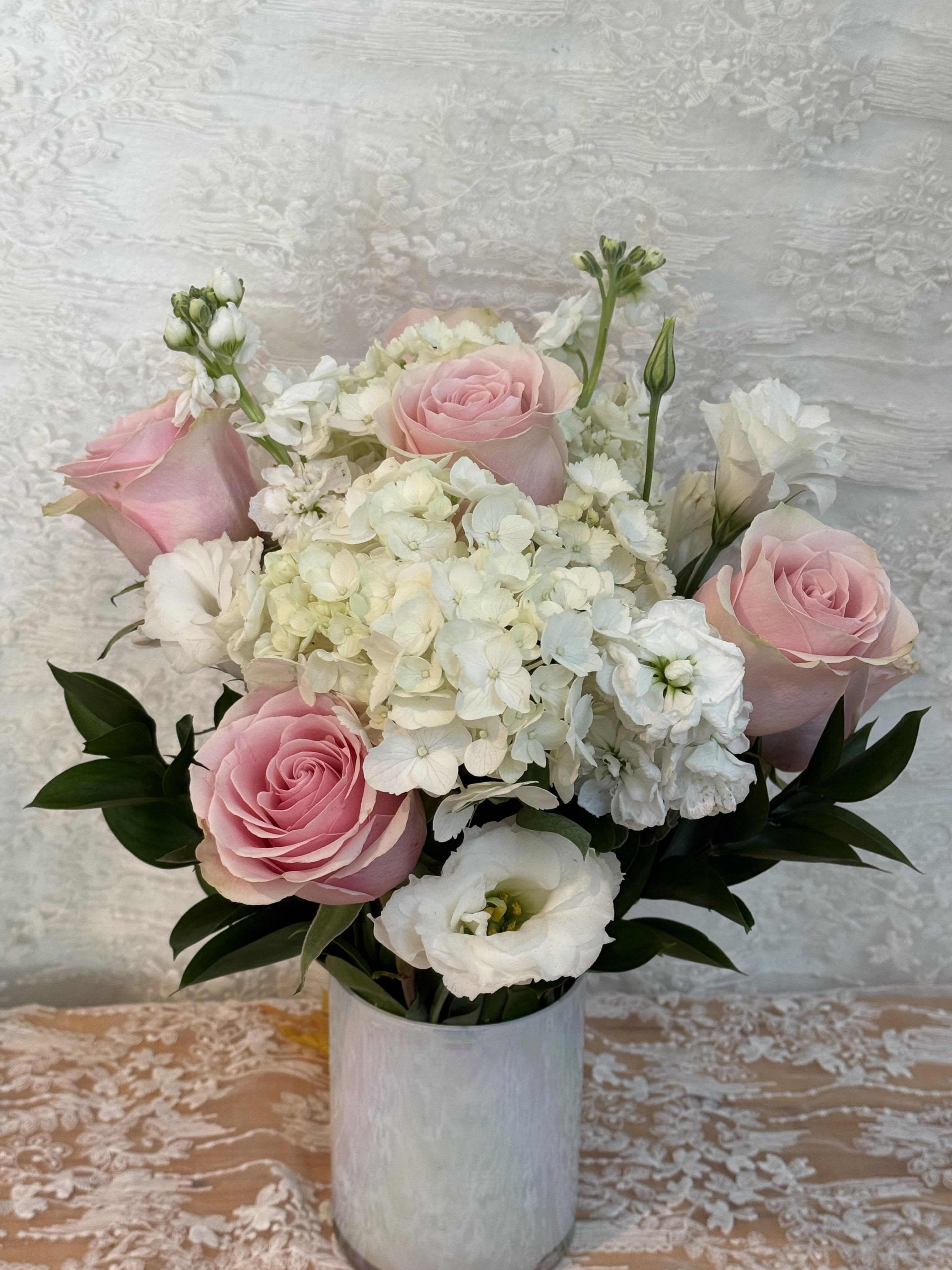 Heart Warming - Soft pink and white flowers Roses, hydrangeas and lisianthus   If a particular flower, is unavailable, an item of similar quality and value will be substituted. 