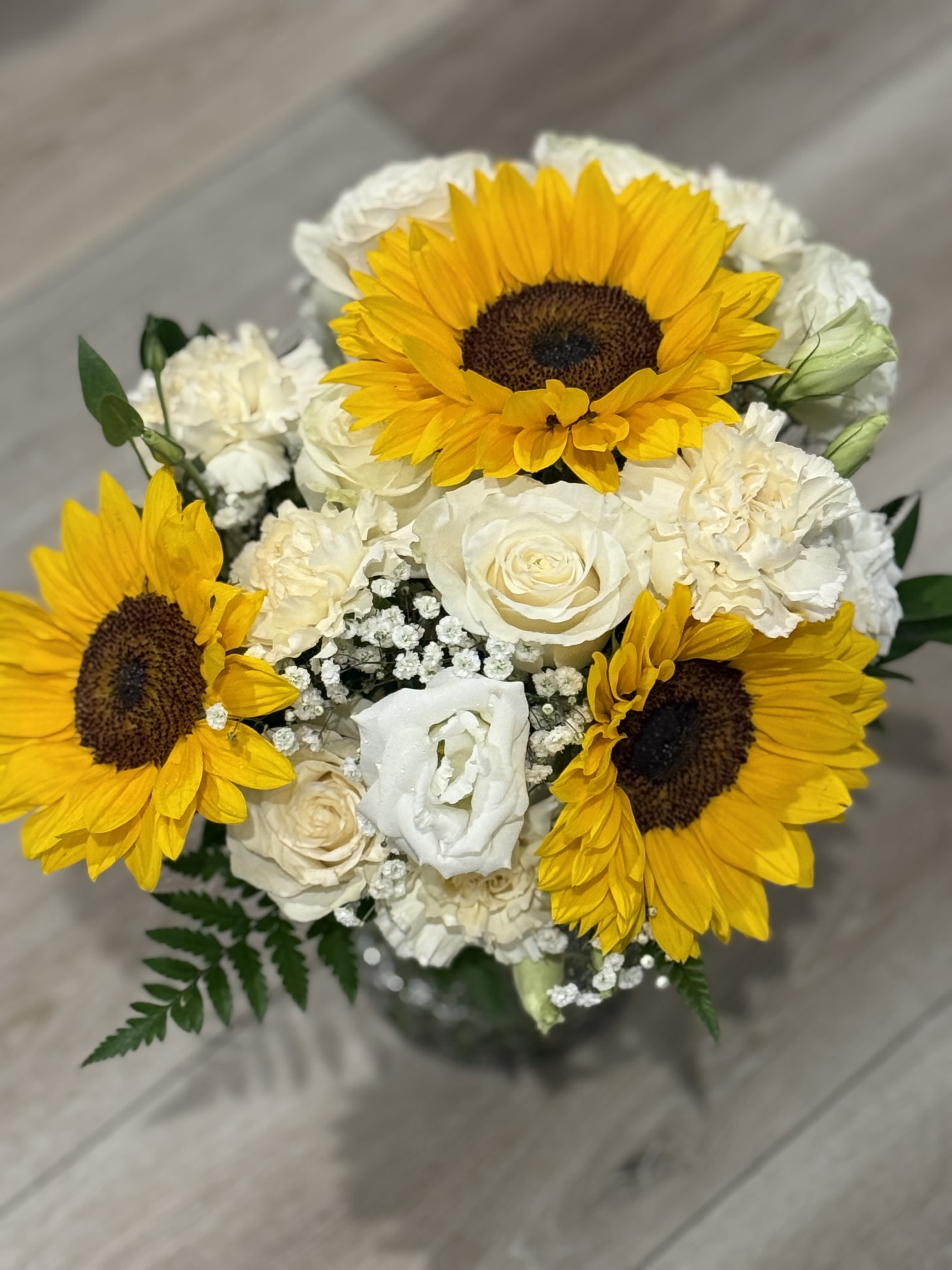 Mellow Yellow - Mix flower arrangement for any occasion   Sunflowers  White Roses  Cream carnations  White Lisianthus  Gypsophilia 
