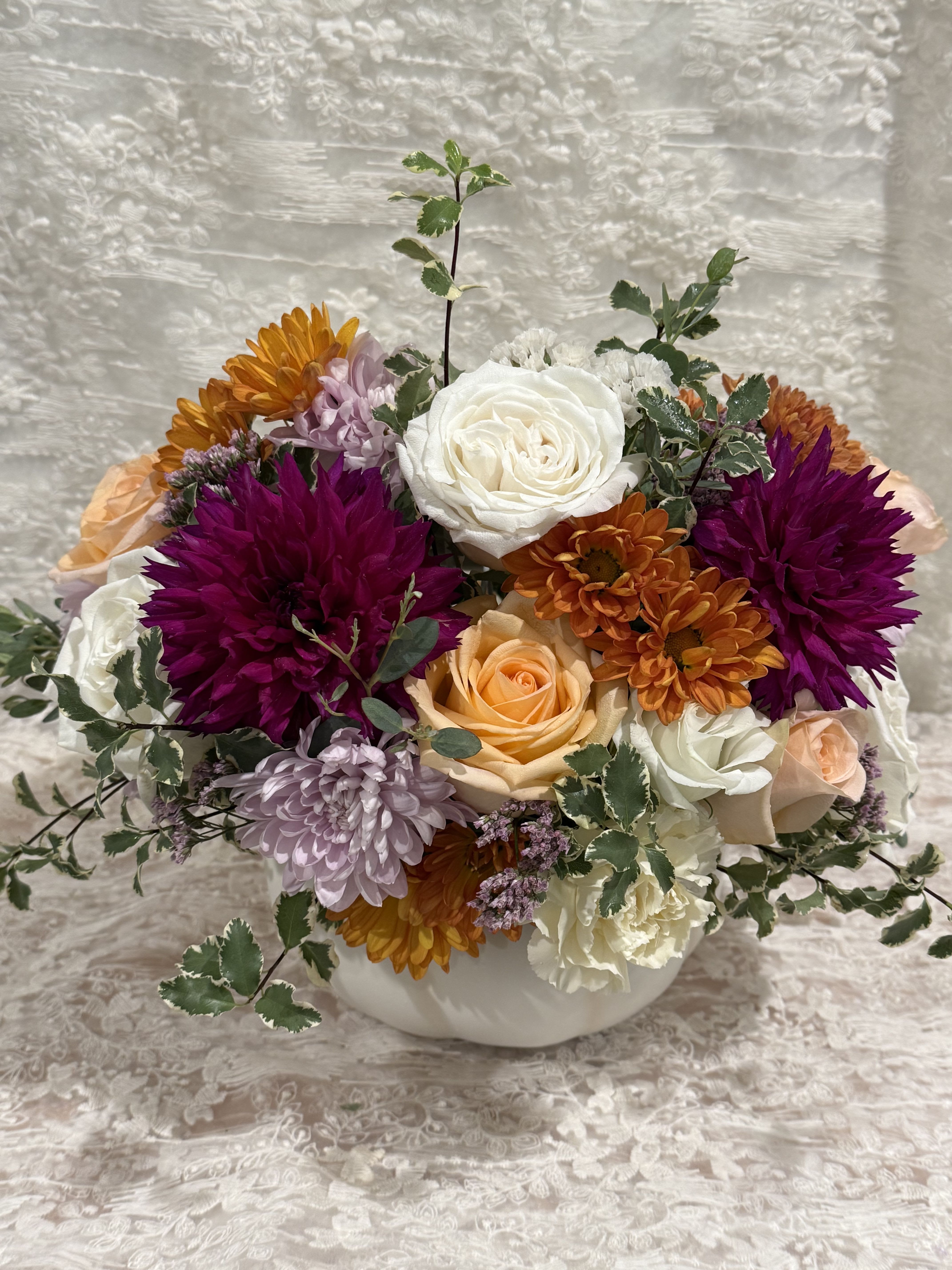 Love in the Fall Pumpkin  - Designers choice ceramic pumpkin with lid  Pumpkin is FDA approved   Enjoy a ceramic pumpkin filled with in season fall flowers.   If a particular flower, is unavailable, an item of similar quality and value will be substituted.