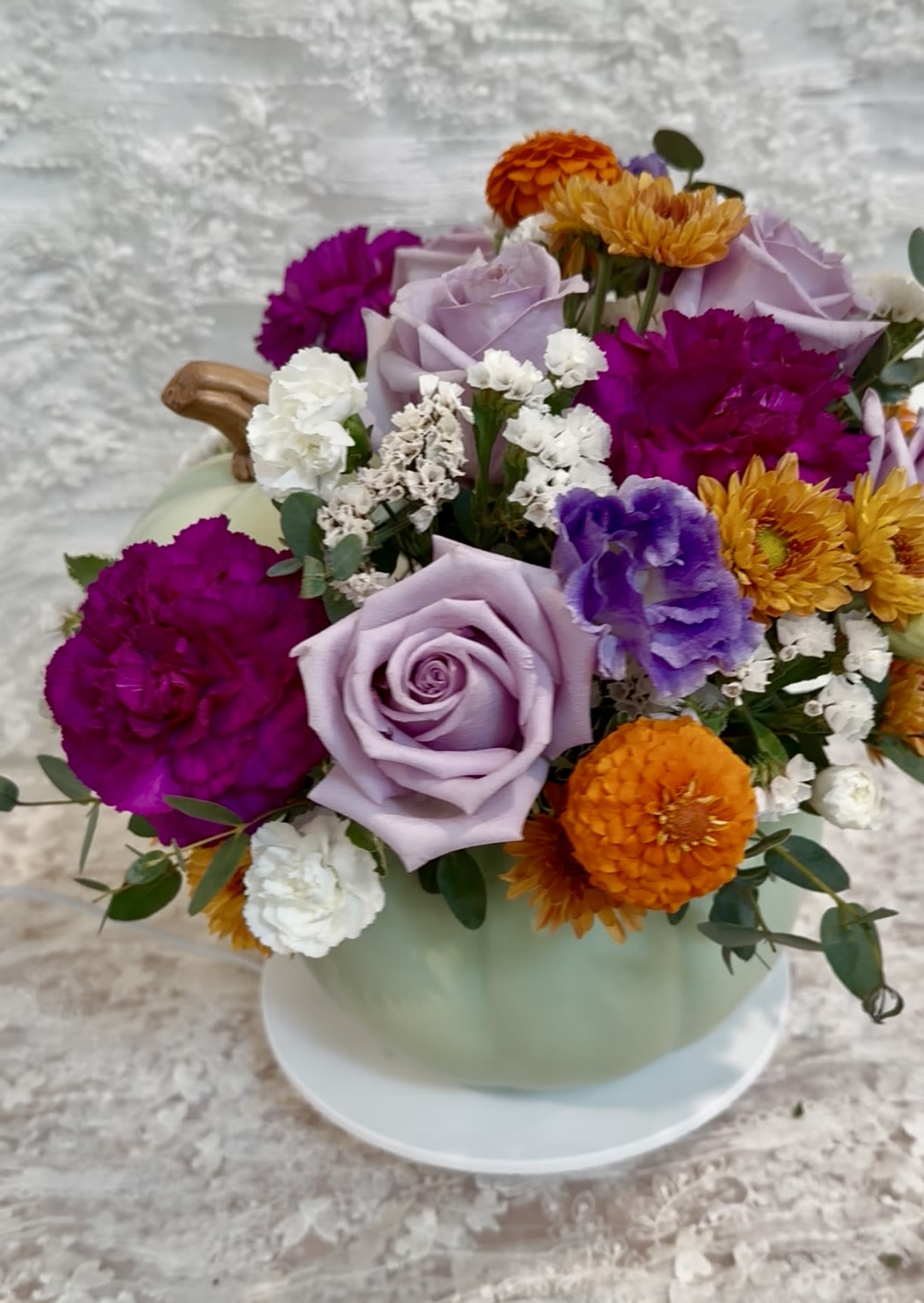 Witchy Pumpkin - Sage ceramic pumpkin with lid filled with purple tone flowers with a touch of orange  FDA approved ceramic pumpkin   If a particular flower, is unavailable, an item of similar quality and value will be substituted.