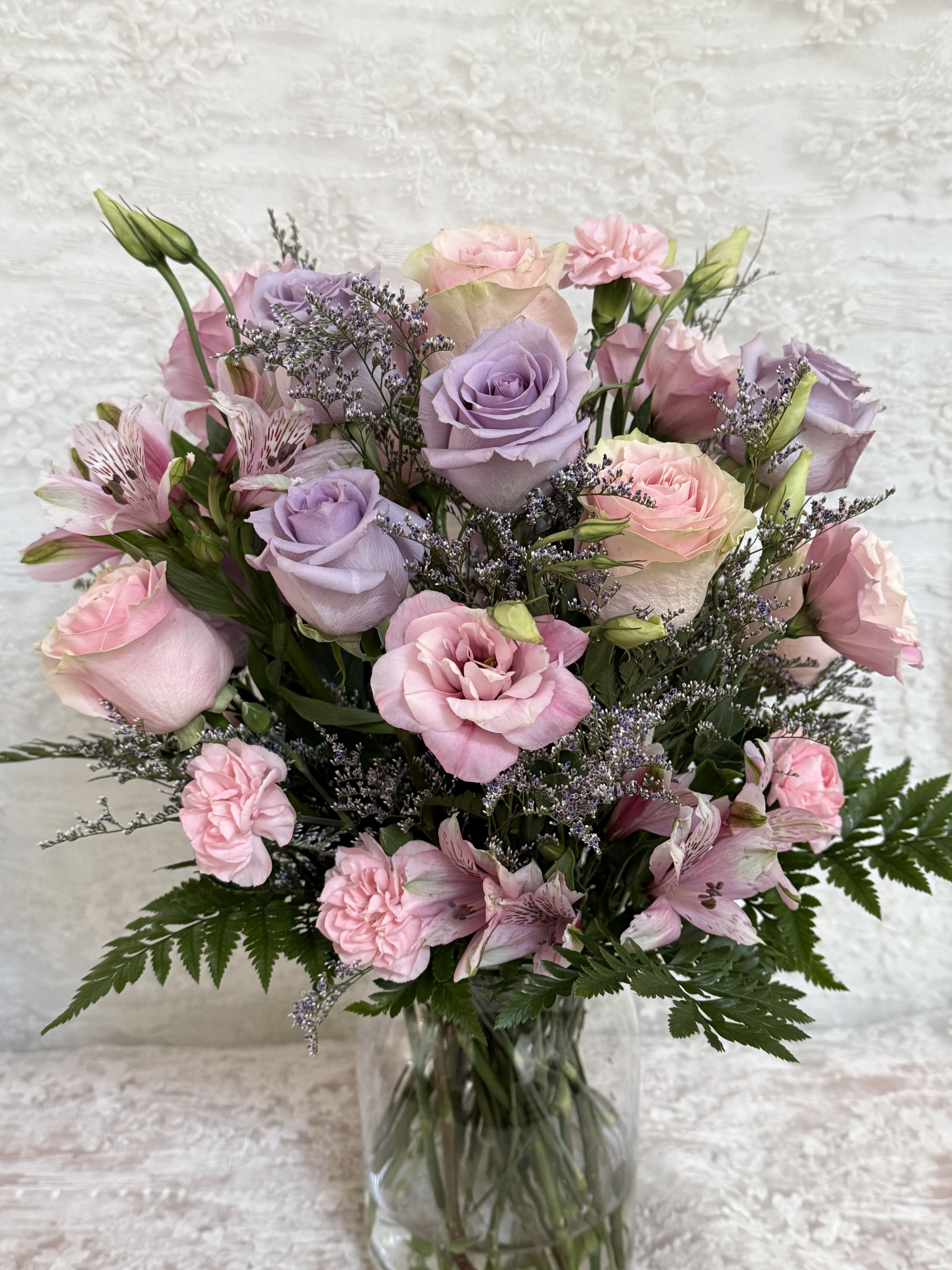 Wishes - Send your loved one some birthday wishes   Mix arrangement of light pink and lavender roses
