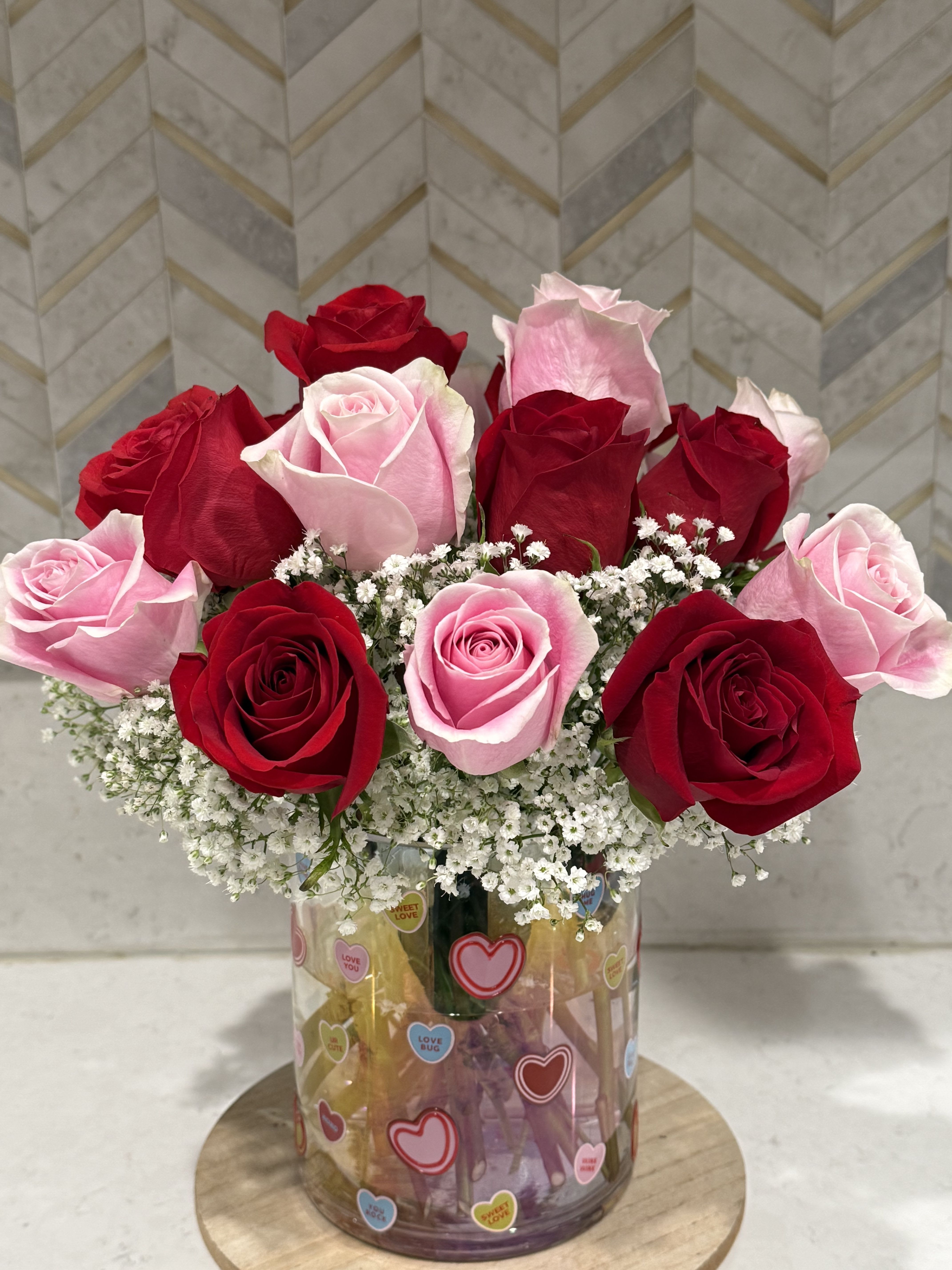Sweethearts  - Mix of red and pink roses in a sweetheart vase  Two dozen roses